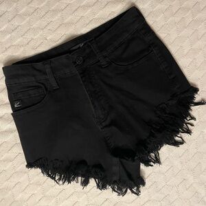 Cheeky, high-waisted black shorts
